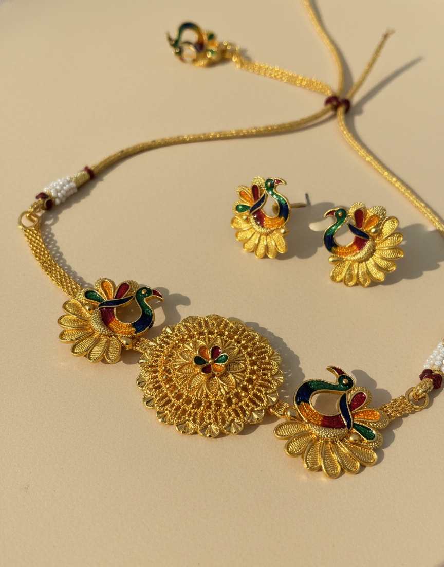 Gold jewelry set with necklace, earrings, and ring on a beige background