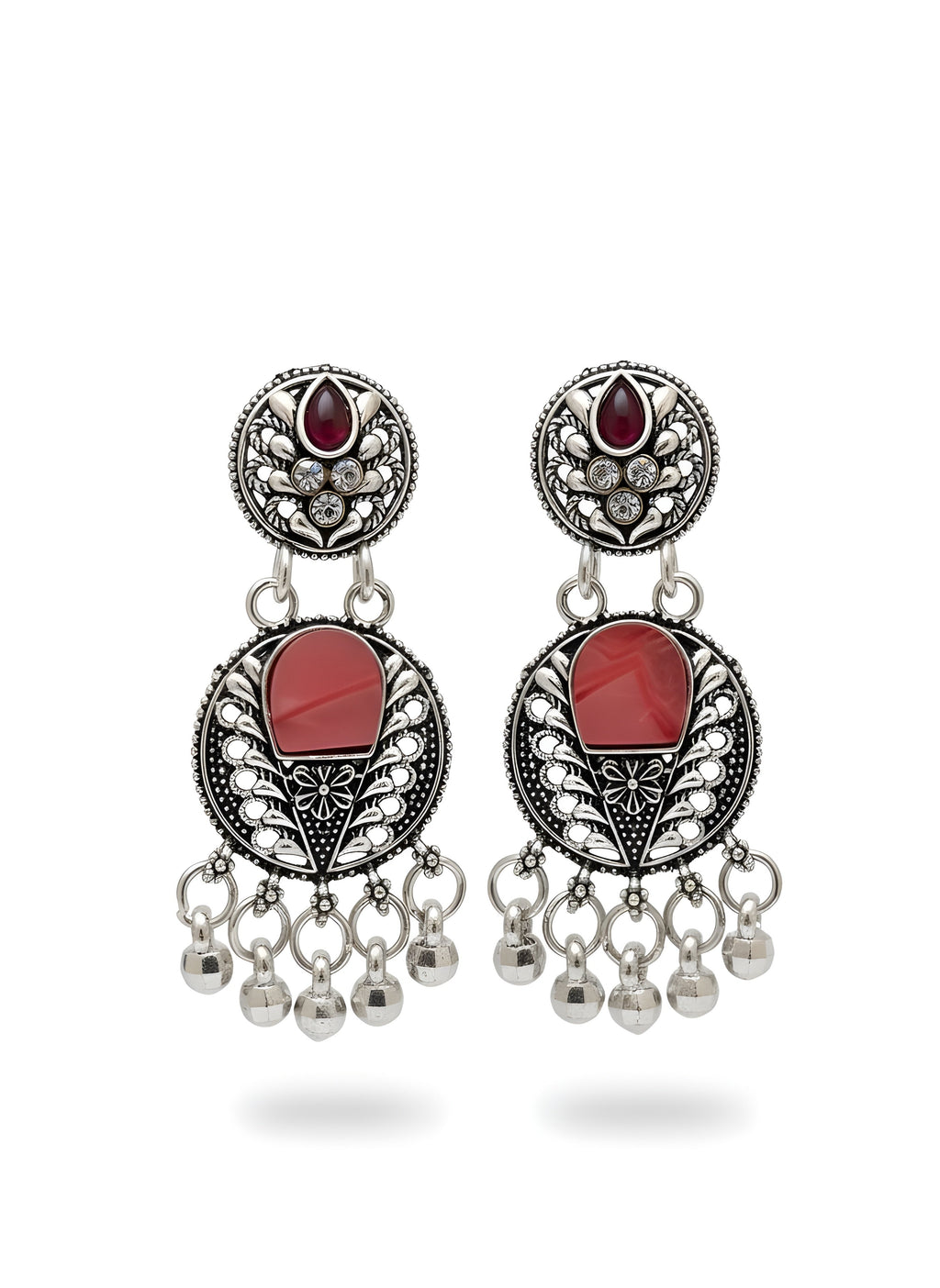 Pair of earrings with red stones and dangling beads on a white background