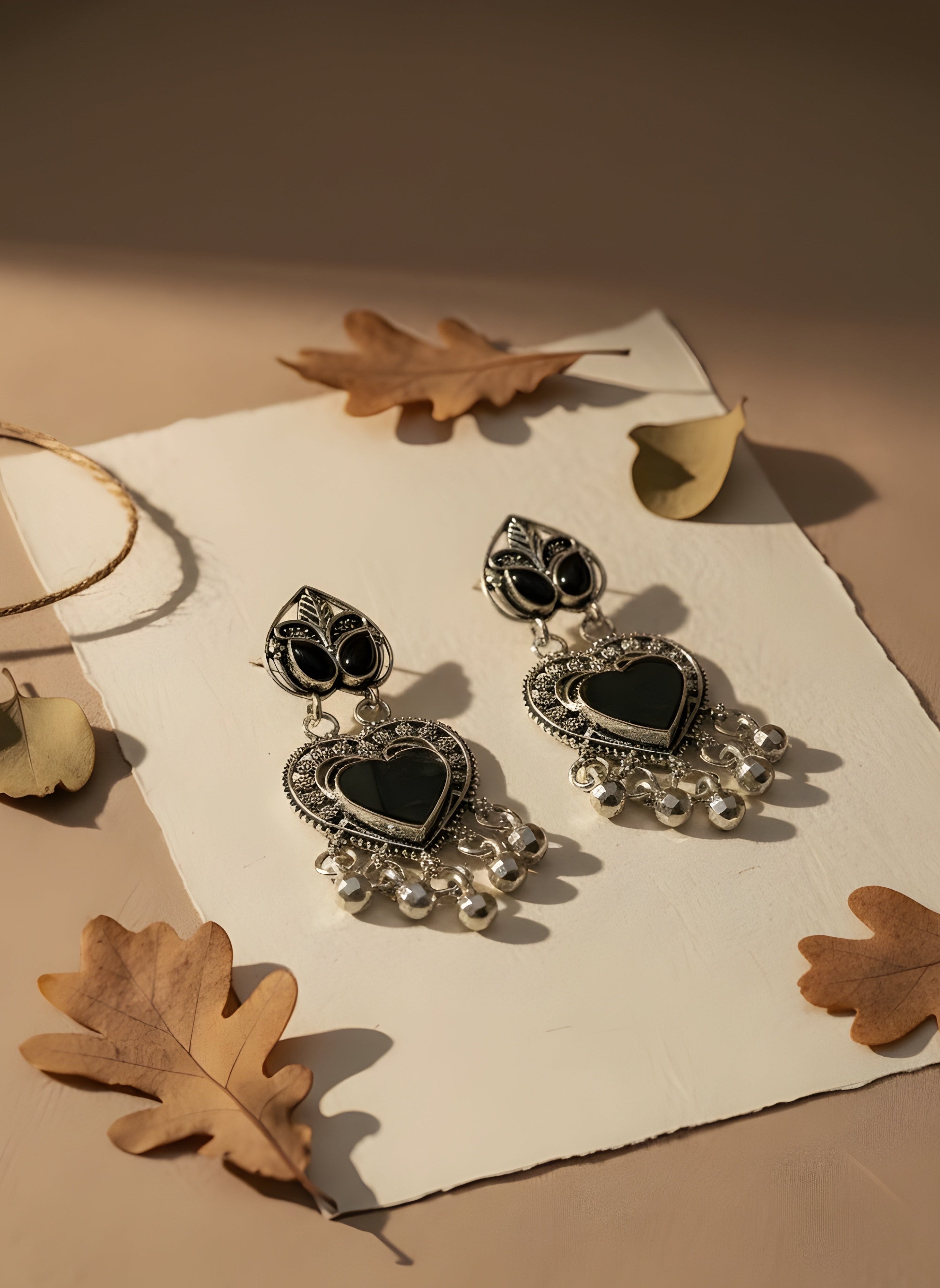 Vanika Black Oxidized Silver Heart Ethnic Dangler Earrings