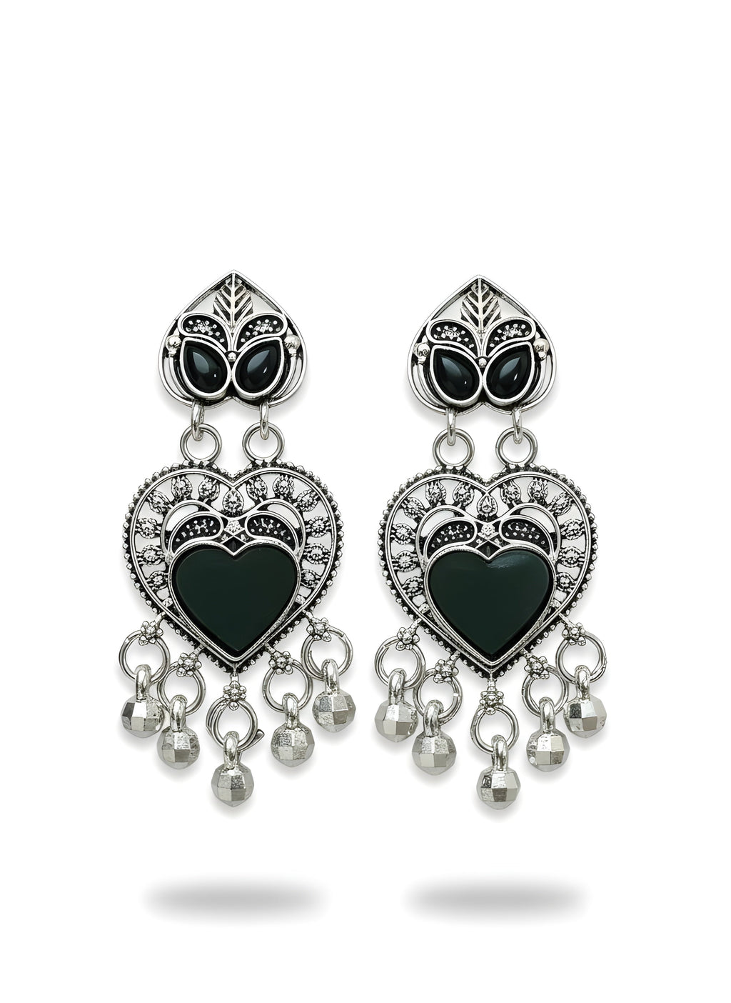 Pair of heart-shaped earrings with black centers and silver accents on a white background