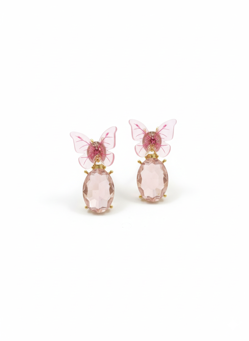 Pair of pink butterfly earrings on a white background