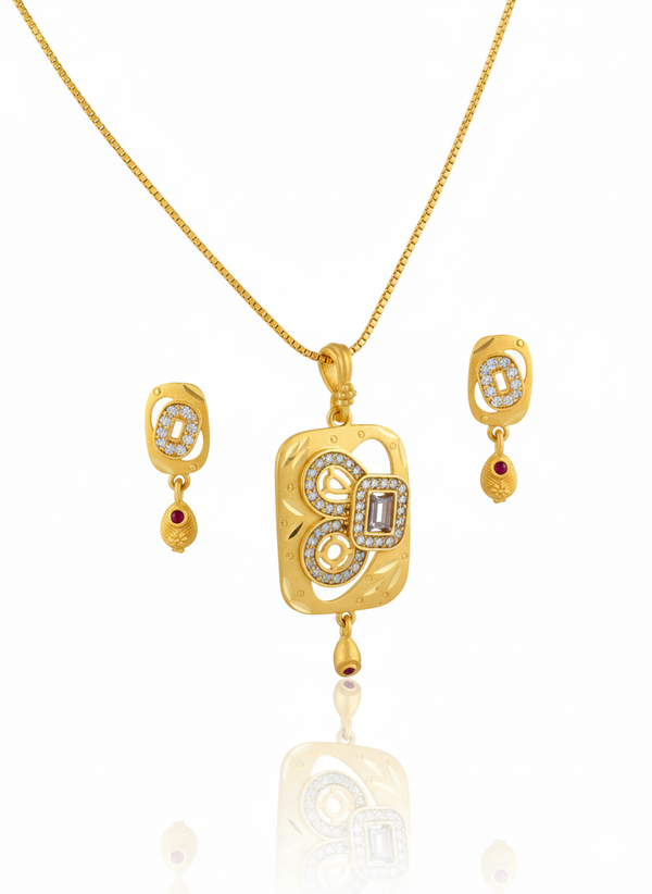 Gold jewelry set with pendant and earrings on a white background