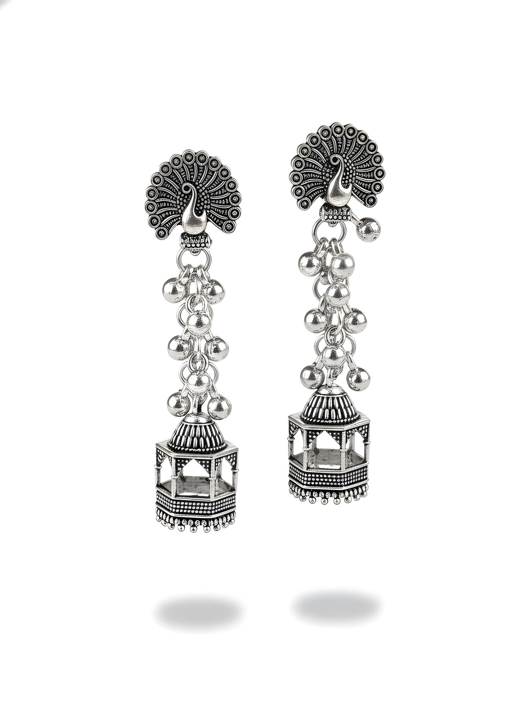 Pair of silver earrings with intricate designs on a white background
