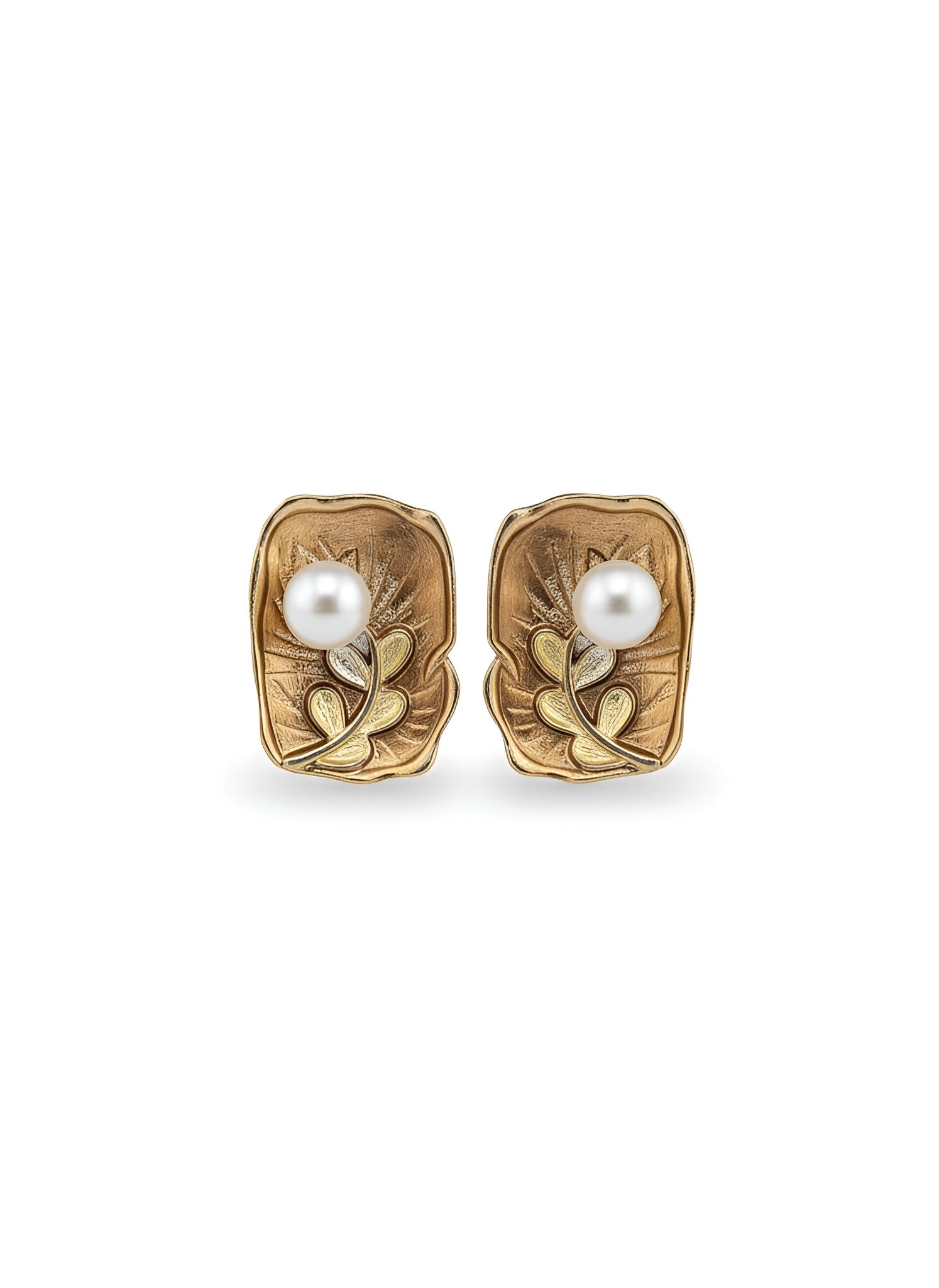 Pair of gold earrings with pearl centers on a white background